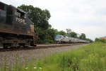 Amtrak 124 takes train 07T west, while NS 7555 waits on the siding